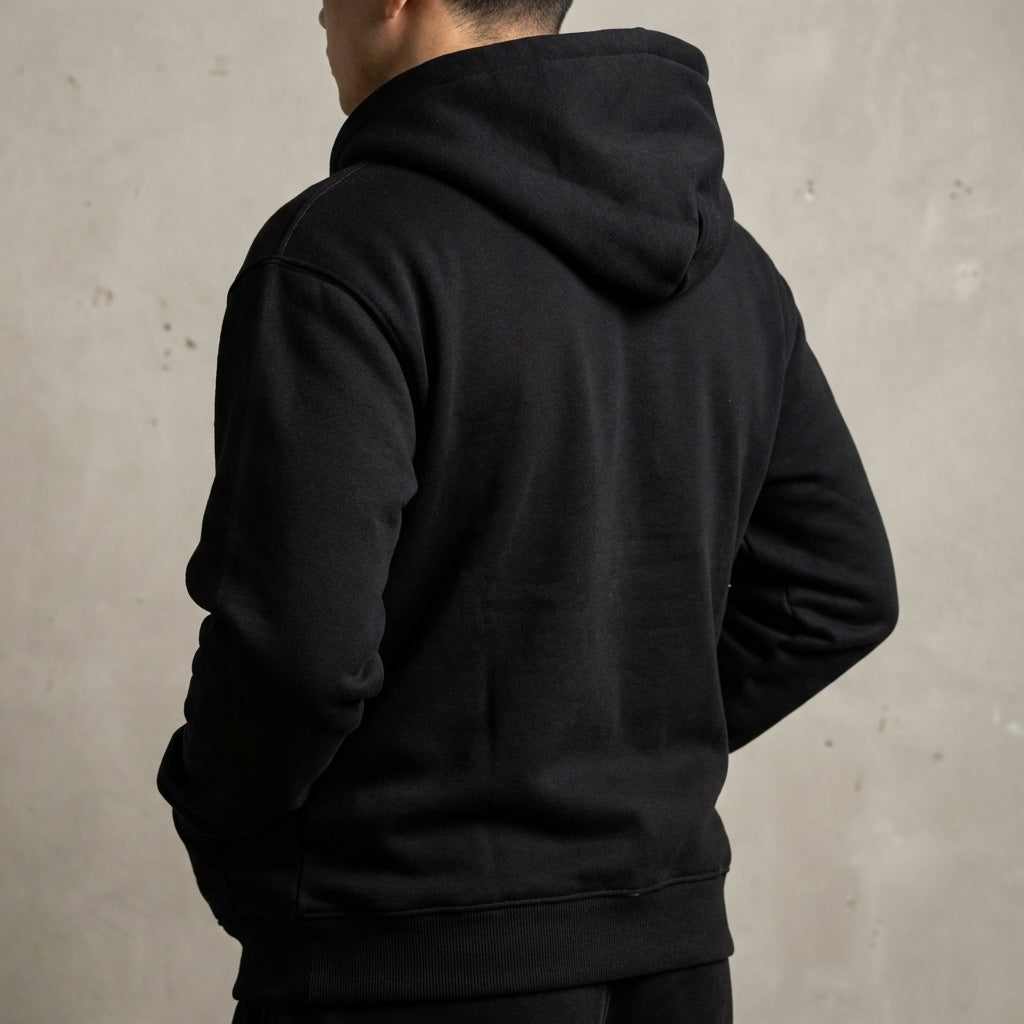 Over-the-shoulder view of Lalucce Hoodie in studio with neutral backdrop, highlighting fabric weave and stitching details.